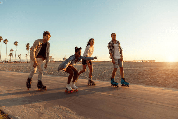 Friends skating on a California boardwalk