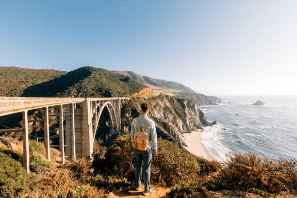 Traveler overlooking the Big Sur coast